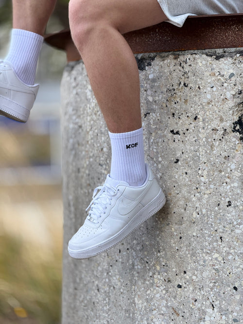 KOF Unisex zeķes baltas ar melnu uzrakstu OEKO-TEX®
